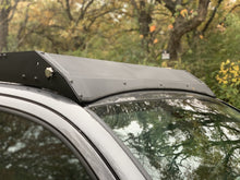 Load image into Gallery viewer, Close up view of gray Toyota Tacoma with Premium Roof Rack with covered light bar - Cali Raised LED