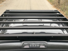 Load image into Gallery viewer, Top down rear view of gray Toyota Tacoma with Premium roof rack - Cali Raised LED