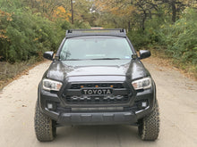 Load image into Gallery viewer, Front view of gray Toyota Tacoma with Premium roof rack with covered light bar - Cali Raised LED